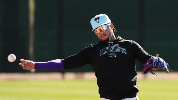 Ketel Marte throws a baseball on February 22nd, 2024
